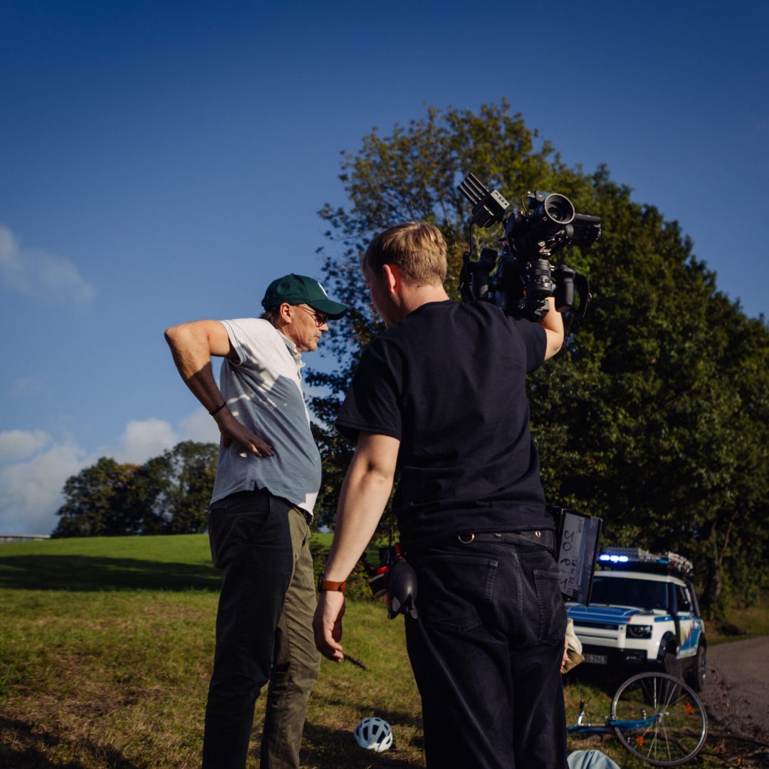DP and 1st AC planning their next shot in the sun