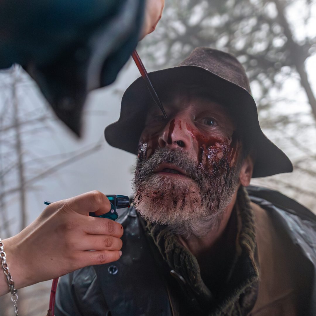 Behind the Scenes of a Microdrama Production inside of the black Forest Studios in Europe where a mean gets fake blood in his face